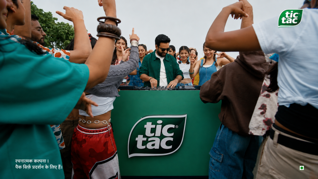 Tic Tac Refresh Your Vibe campaign showing a group dancing around a branded display.