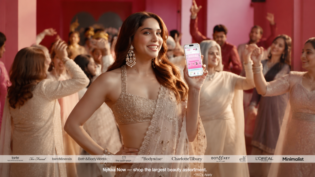 Nykaa Now campaign showing a woman holding beauty products at a celebration.