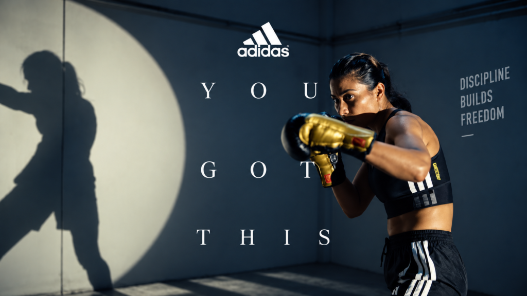 Adidas You Got This campaign showing a female athlete wearing boxing gloves.