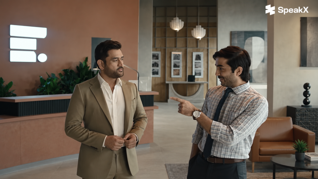 SpeakX campaign showing two men talking in an office reception area.