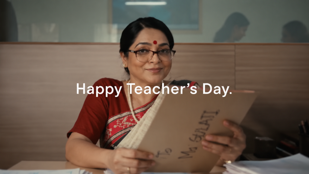 OpenAI Teacher's Day campaign showing a teacher in a saree holding a notebook.