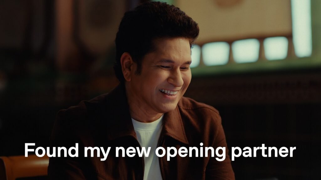 OpenAI campaign showing a man smiling at a screen, captioned Found my new opening partner.