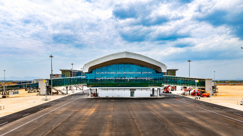 Exterior of an airport terminal under a blue sky.