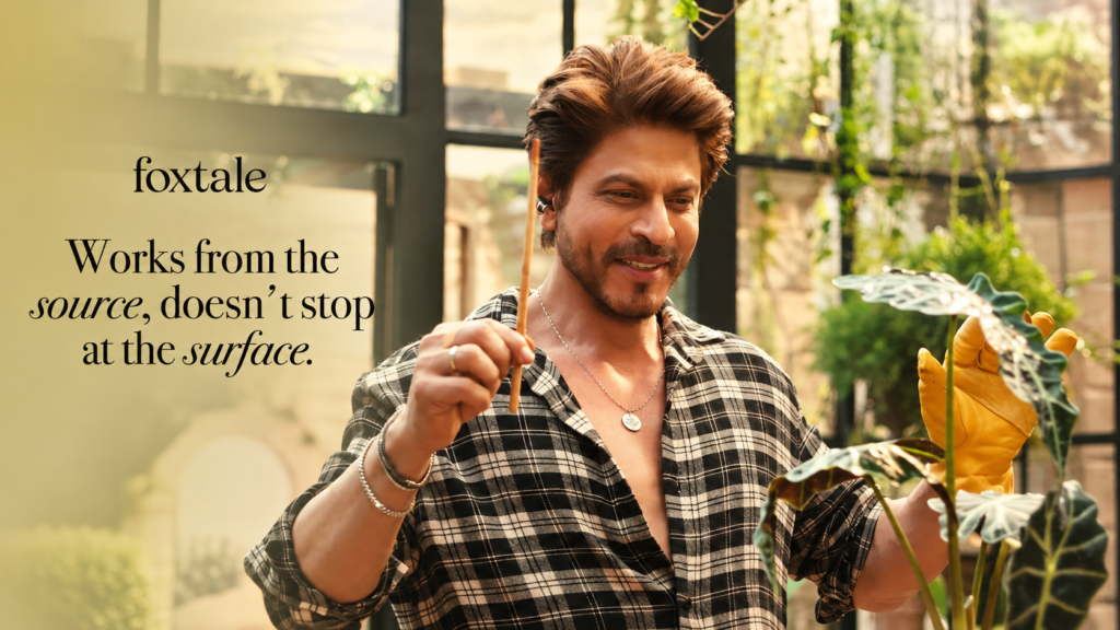Foxtale campaign showing a smiling man holding a bottle of skincare product.