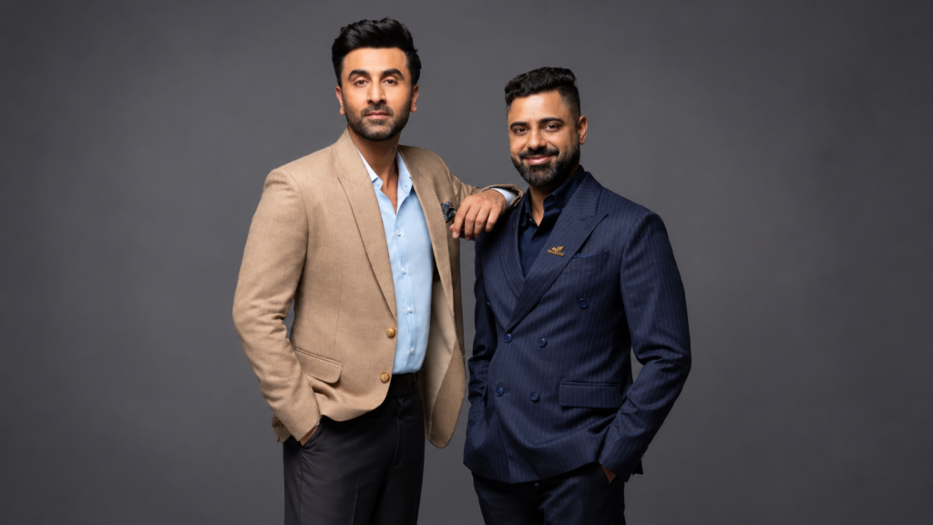 Mantra campaign portrait of two men in suits.