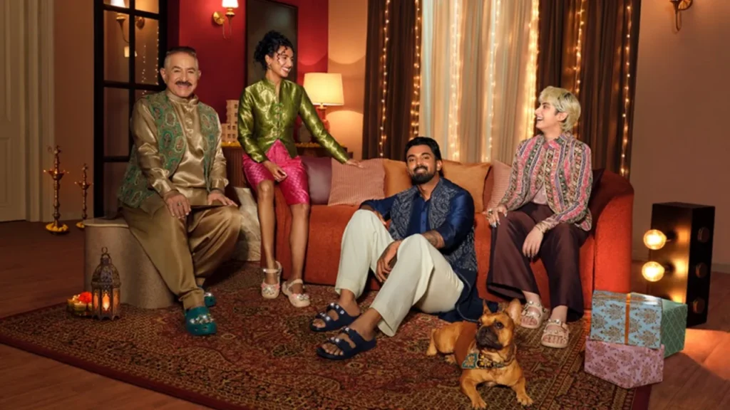 Crocs festive campaign showing a group of people in an Indian-style living room.